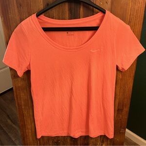 Two Nike dry fit Ladies tees. gray and bright Coral. Worn only a few times.